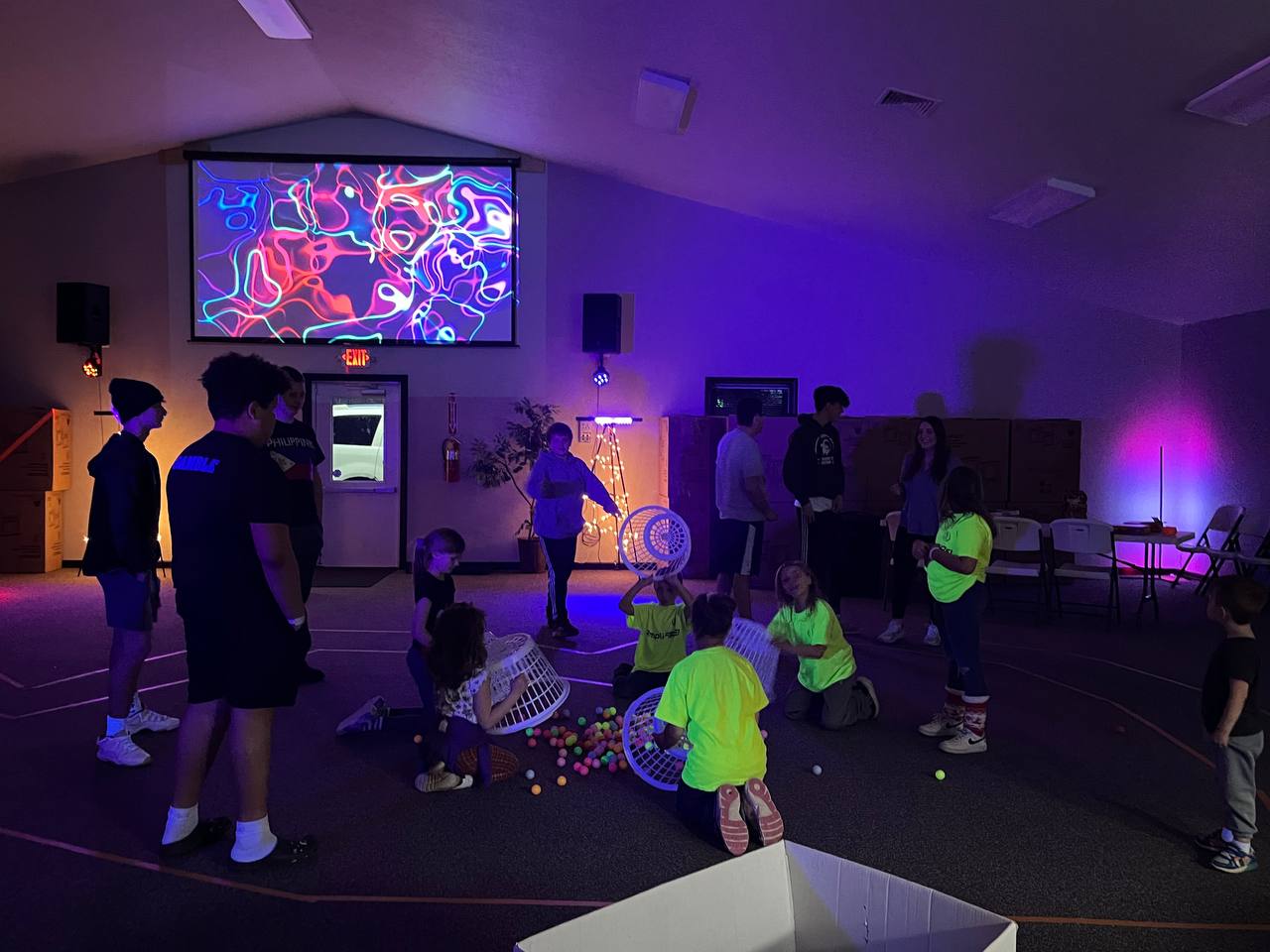 several kids are gathered in a manger scene