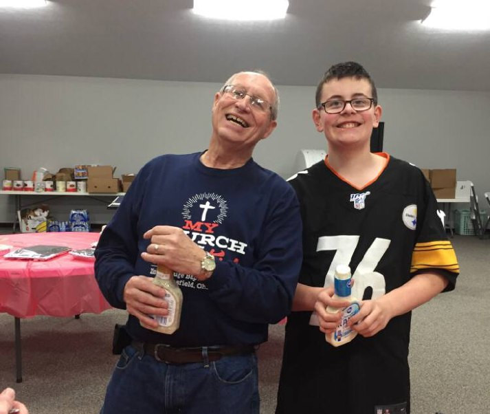 pastor David Parsons poses with a church youth member